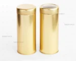قوطی فلزی قطر 6.6 سانت با ارتفاع 13.5 سانت طرح طلایی صدف پک، نمایش دو مدل درب با طلق و بدون طلق در کنار هم