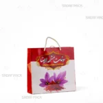 ساک دستی مقوایی 25*25 سانتی‌متر صدف پک با طرح گل زعفران و دسته طناب مناسب بسته‌بندی هدیه محصولات زعفران و سوغات خراسان