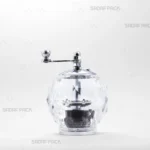 نمای روبروی زعفران ساب کریستالی مدل الماس صدف پک، با بدنه شفاف برای مشاهده محتویات، درپوش و دسته فلزی با آبکاری کروم و مکانیزم سایش چرخشی برای پودر کردن یکنواخت رشته‌های زعفران